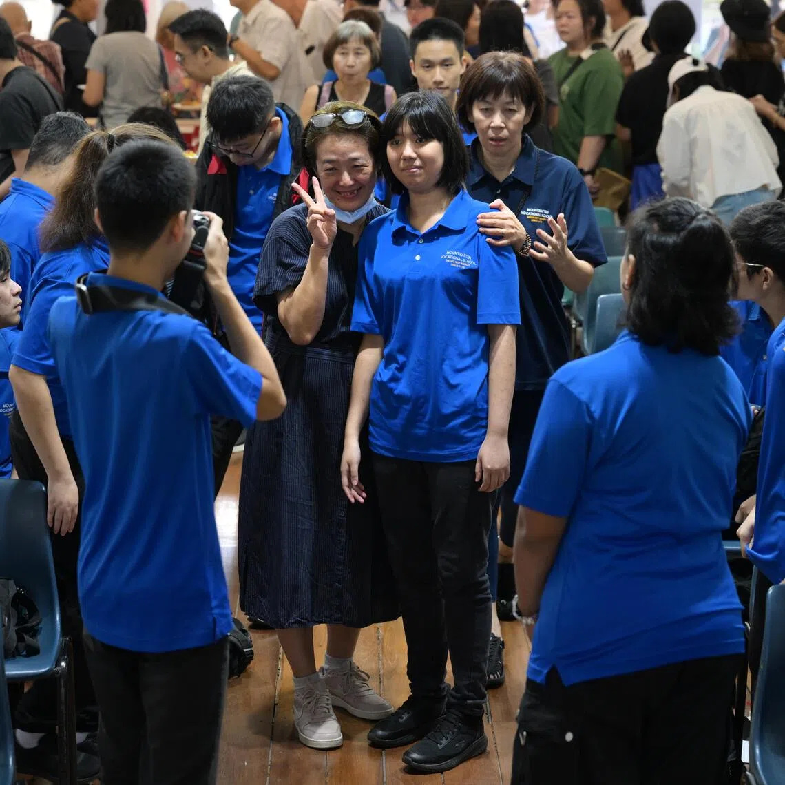 smmountbatten/ST20251120_202596800176/Ng Sor Luan/Mountbatten Vocational School (MVS) for special needs students will close by end of 2025. MVS holds its final year-end prize-giving ceremony and carnival on Nov 20, 2025. Educator Doreen Lim, 54, whose son is a student at the school takes photos with her son's classmate, Huang Meiru, 19.