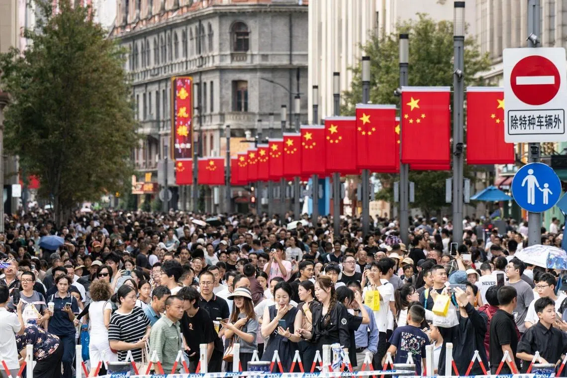 Pedestrians in the Nanjing Road shopping area during the Golden Week holiday in Shanghai, China, on  Oct. 2, 2025.