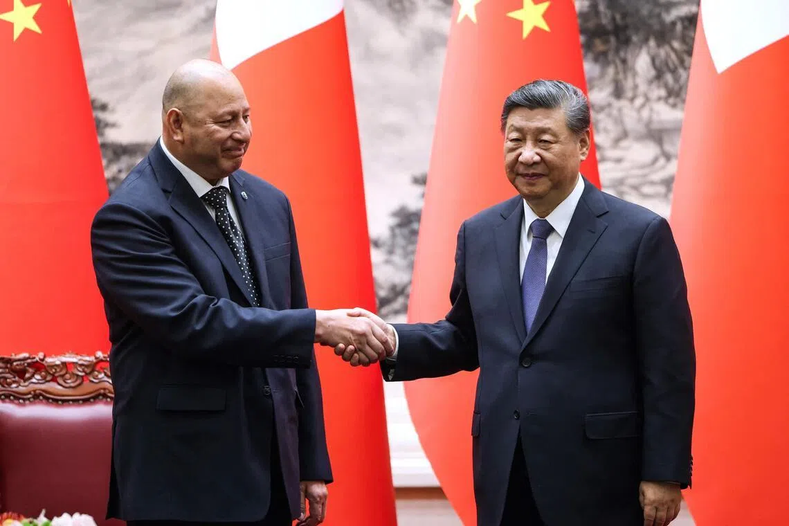Tonga’s King Tupou VI and China’s President Xi Jinping shaking hands after a signing ceremony at the Great Hall of the People in Beijing on Nov 25, 2025.