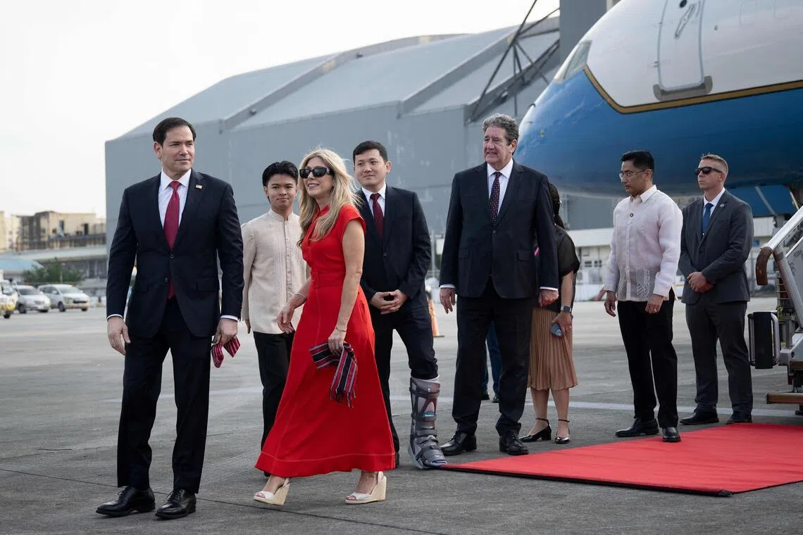US Secretary of State Marco Rubio (left) and his wife Jeanette Dousdebes Rubio arrive at Ninoy Aquino International Airport in Manila, on July 21.