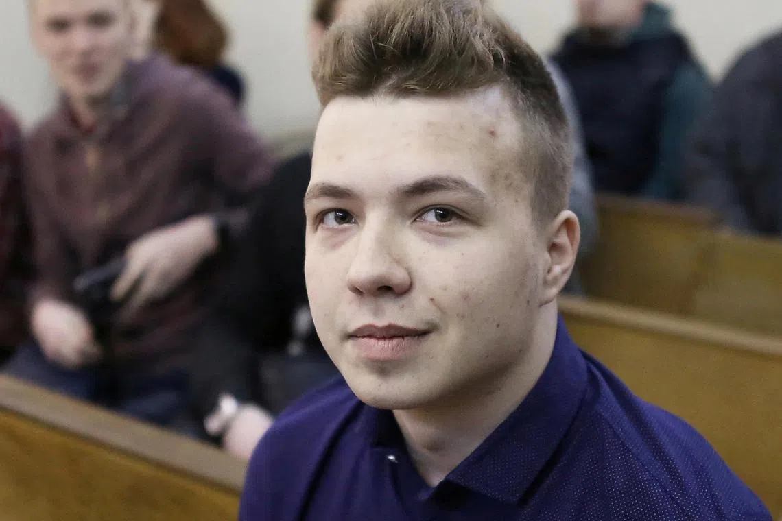 FILE PHOTO: Opposition blogger and activist Roman Protasevich, who is accused of participating in an unsanctioned protest at the Kuropaty preserve, waits before the beginning of a court hearing in Minsk, Belarus April 10, 2017. REUTERS/Stringer/File Photo