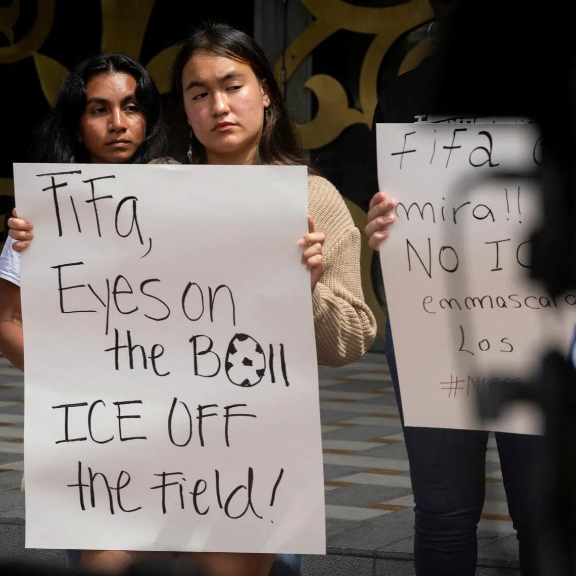 Immigration advocates gather outside FIFA's offices to demand that the organization bans ICE and CBP presence at upcoming World Cup events, in Coral Gables, Florida, U.S., June 30, 2025. REUTERS/Marco Bello/File Photo