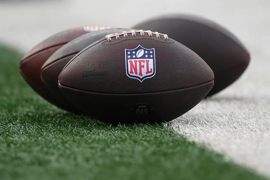 FILE PHOTO: Aug 16, 2025; East Rutherford, New Jersey, USA; General view of the National Football League logo on footballs prior to the game between the New York Jets and the New York Giants at MetLife Stadium. Mandatory Credit: Rich Barnes-Imagn Images/File Photo