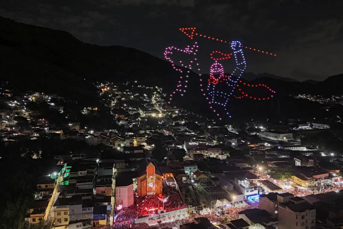The figure of Saint George is recreated with drones next to the church during the Saint George's Day celebrations at the Quintino neighborhood in Rio de Janeiro, Brazil on April 23, 2026. 