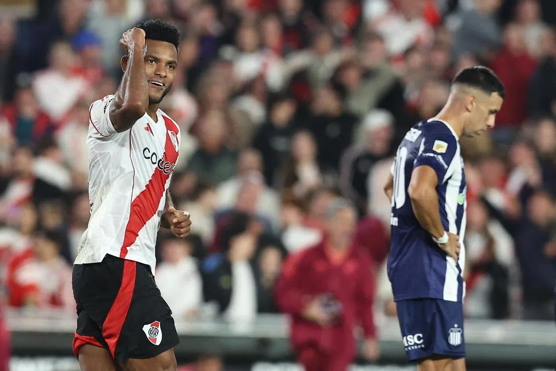 River Plate's Colombian forward Miguel Borja celebrates scoring his team's equaliser against Talleres in the Argentine Apertura Tournament at Monumental stadium in Buenos Aires on April 13, 2025.