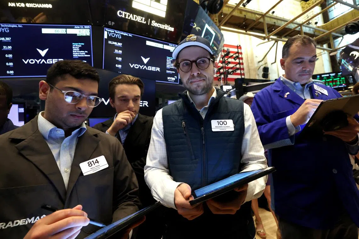 Traders working on the floor of the New York Stock Exchange, in New York City, on June 11.