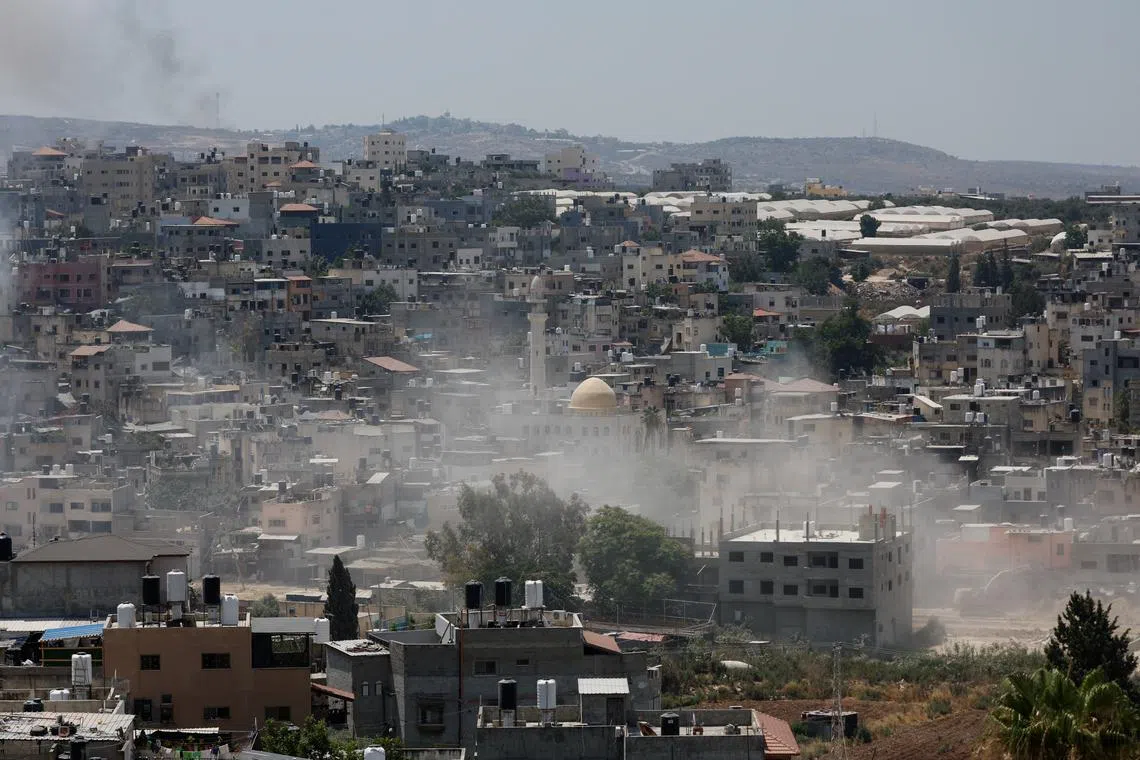 FILE PHOTO: Dust is seen as an Israeli army bulldozer operates during an Israeli raid in Nour Shams camp, in Tulkarm, in the Israeli-occupied West Bank, July 9, 2024. REUTERS/Mohammed Torokman/File Photo