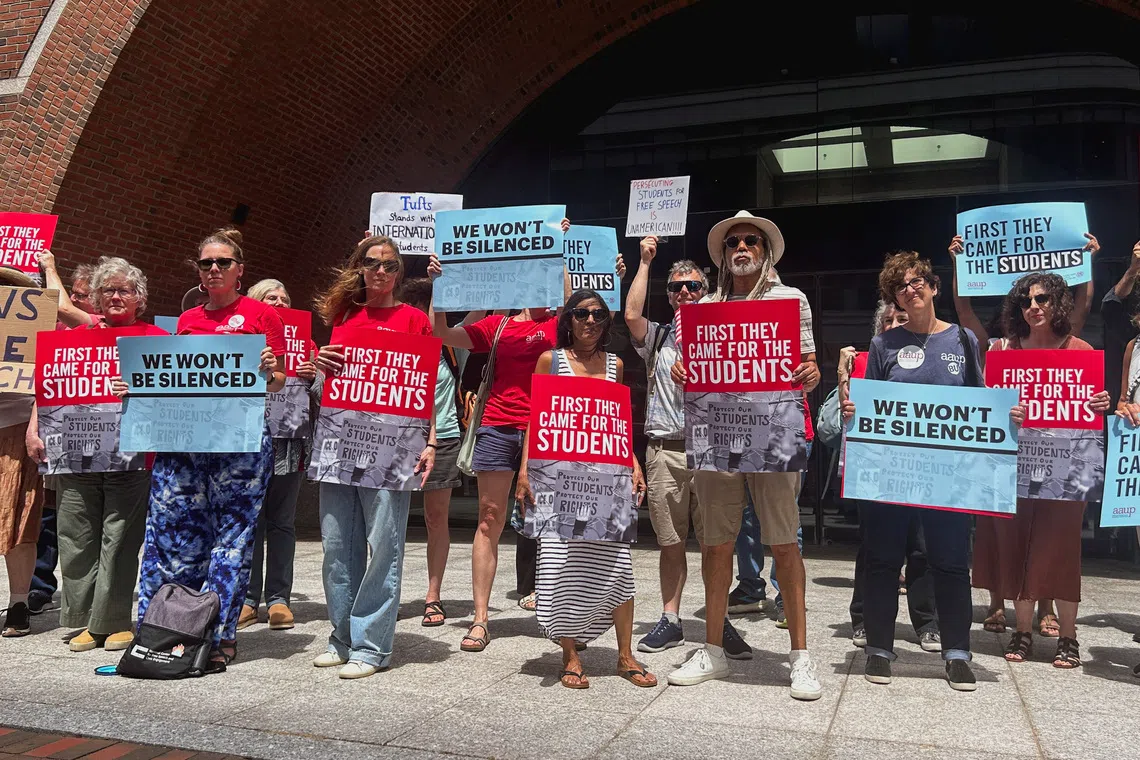 Demonstrators stand outside the federal courthouse after the first day of a trial in a lawsuit filed by the American Association of University Professors and others, which challenges the U.S. President Donald Trump administration's arrest and deportation of pro-Palestinian campus activists, in Boston, Massachusetts, U.S., July 7, 2025. REUTERS/Nate Raymond