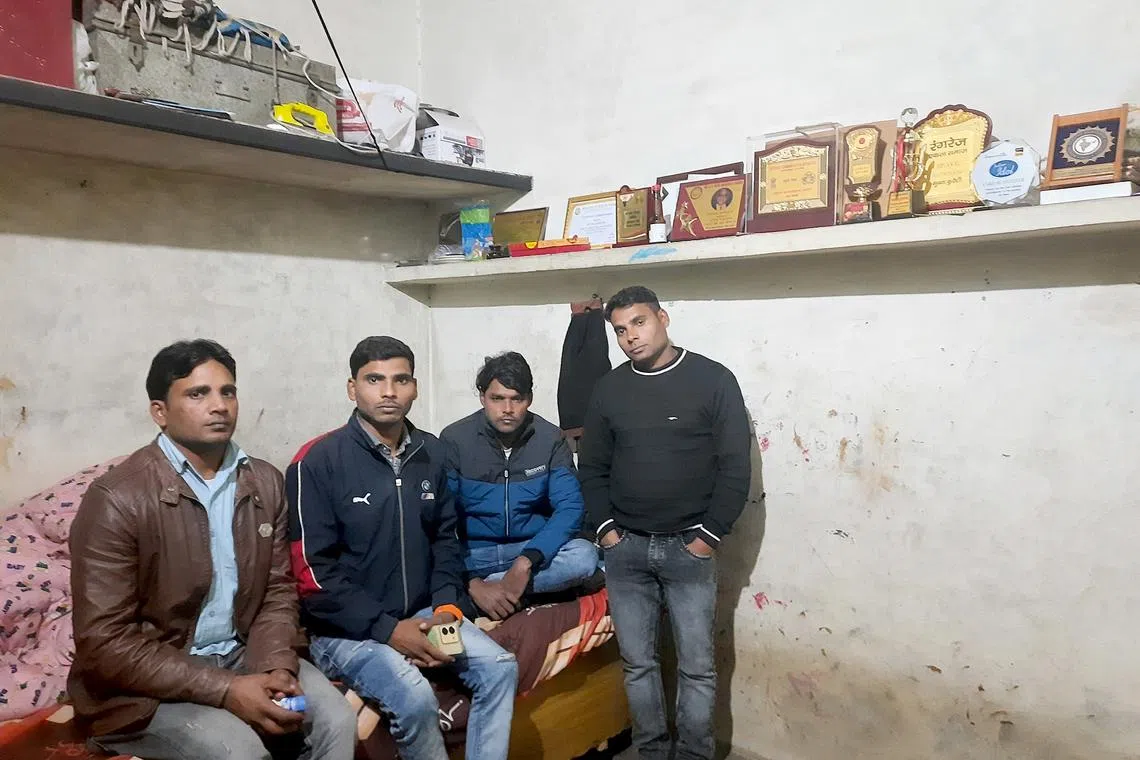 (From left to right) Mohammad Rashid, Munna Qureshi, Naseem Malik and Firoz Qureshi at Munna's rented one-room tenement in Delhi. The shelf on the right is taken up by trophies and mementoes that the workers have received from across India for their bravery.