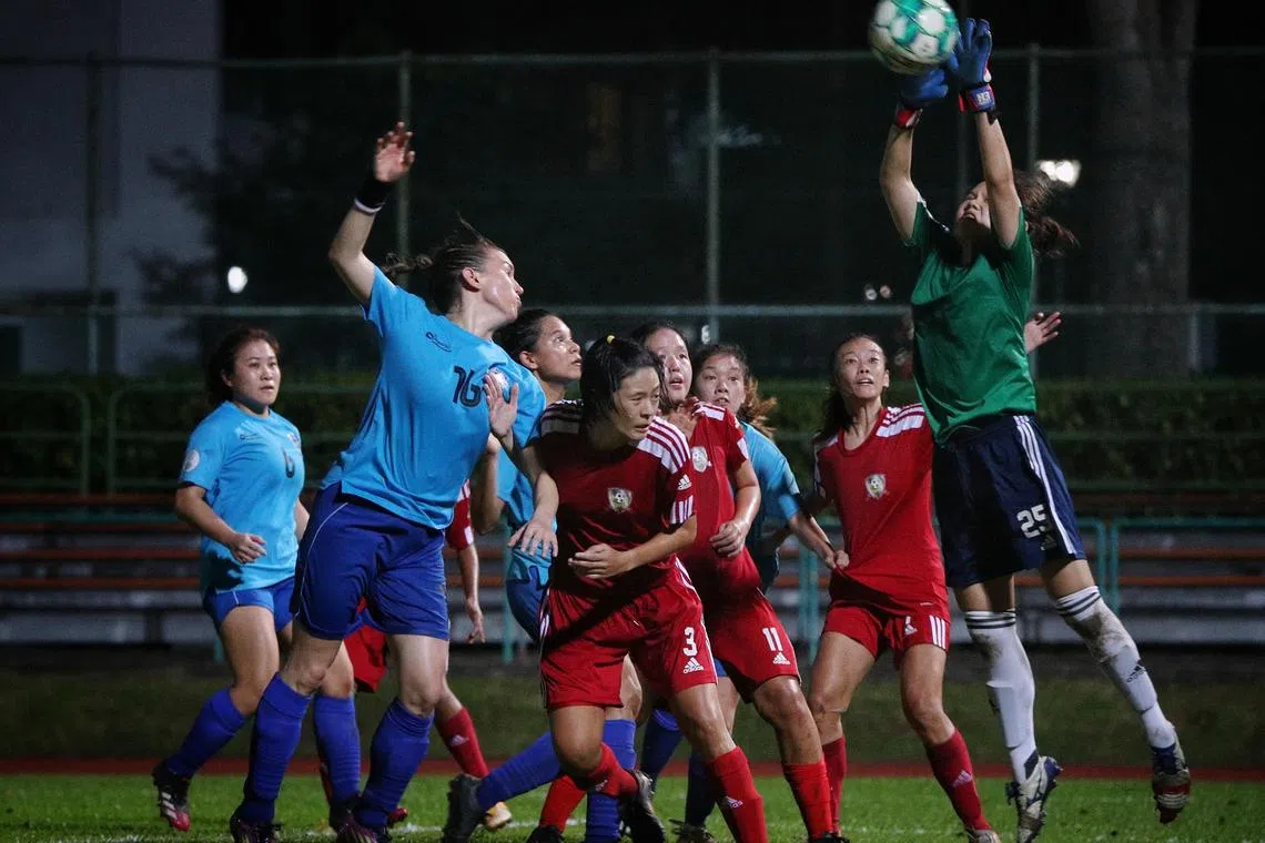 Tiong Bahru goalkeeper Audrey Cheong claiming a Still Aerion cross at the Yishun Stadium on June 12, 2022.  
