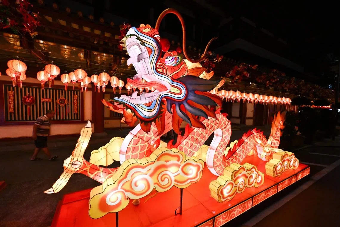 Dragon-themed lantern display outside Buddha Tooth Relic Temple for the Chinese New Year celebrations.