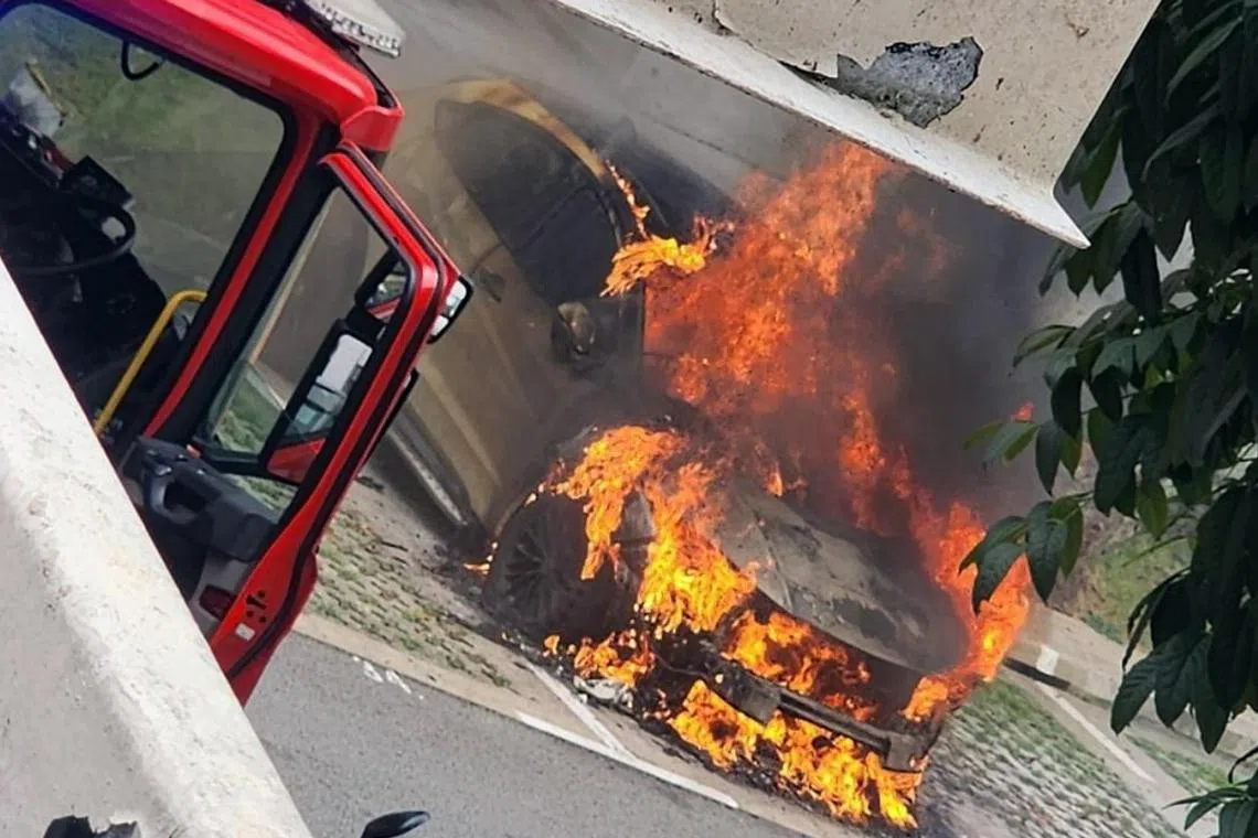 The fire involved the engine of the car.
A car caught fire at an outdoor carpark in Bukit Batok on the afternoon of Nov 17.

When contacted, the Singapore Civil Defence Force (SCDF) said it was alerted to the fire at the carpark of Block 239 Bukit Batok East Avenue 5 at about 12.30pm.

The fire involved the engine of the car, added SCDF. PHOTO: SCREENGRAB FROM FUAD ODEM/FACEBOOK