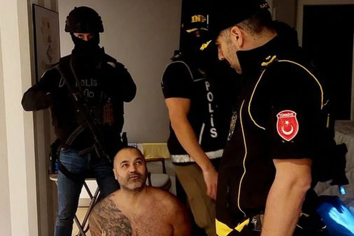 Hakan Ayik, a fugitive wanted in Australia for drug smuggling, is detained by Turkish police in Istanbul, Turkey November 1, 2023. Turkish Interior Ministry/Handout via REUTERS