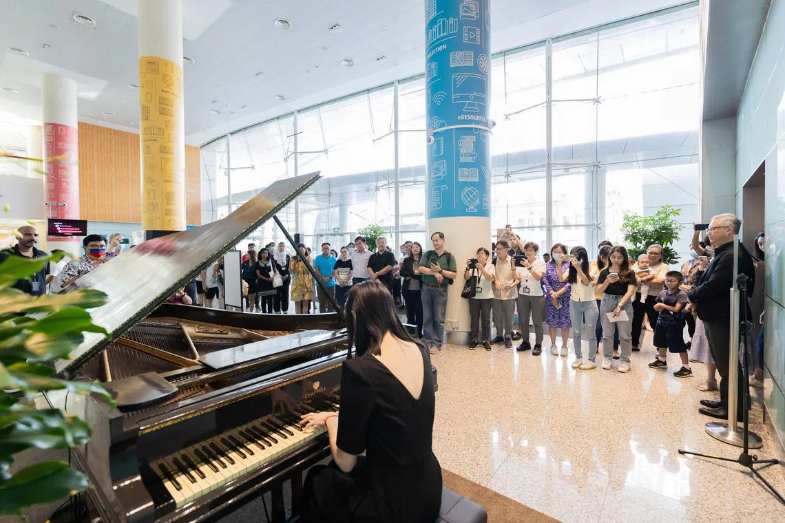 LASALLE alumni Eugena Kwong plays the Chappell Grand piano, formerly the principal concert grand at the Victoria Concert Hall, which has been relocated to the National Library Building for public use.