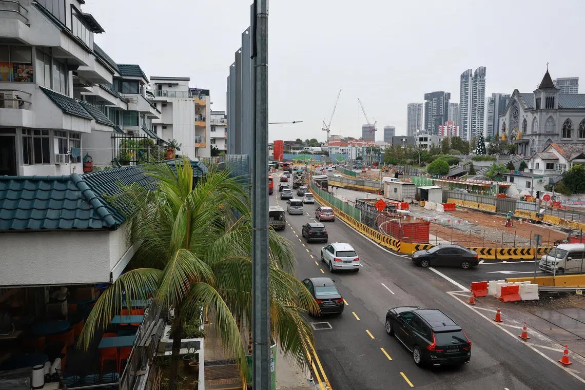 Mr Jack Patel, 42-year-old educator, looking at the traffic and construction from the second-storey apartment he rented along Thomson Road on Dec 23, 2022. His family has been affected by the North-South Corridor constructions due to the loud noises at all hours of the day, bad traffic, vibrations and dust. The family's physical health, mental health, sleep, productivity has suffered. He has three sons - aged 19 months, 3 and 6 - and he spent $2000 to soundproof the baby's room.
