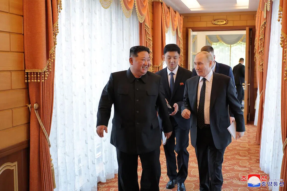 North Korea's leader Kim Jong Un (left) chats with Russia's President Vladimir Putin after their meeting in Pyongyang.