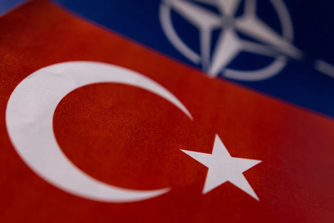 FILE PHOTO: NATO and Turkish flags are seen in this illustration taken May 18, 2022. REUTERS/Dado Ruvic/Illustration/ File Photo