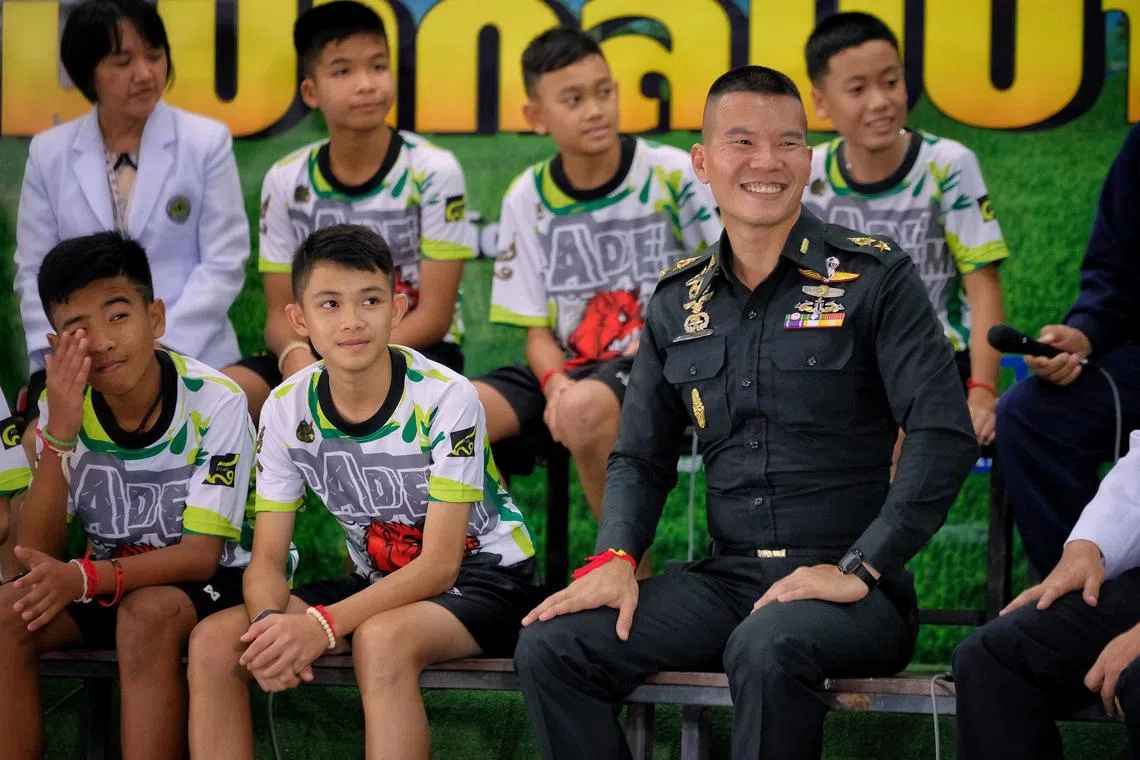 CHIANG RAI, THAILAND - JULY 18: 

Duangpetch Promthep, second from left, has died in the UK after reportedly suffering a head injury.


Twelve boys from the "Wild Boars" soccer team and a Thai Navy SEAL (Right) speak during a press conference for the first time since they were rescued from a cave in northern Thailand last week, on July 18, 2018 in Chiang Rai, Thailand. The 12 boys, aged 11 to 16, and their 25-year-old coach were discharged early from Chiang Rai Prachanukroh hospital after a speedy recovery and thanked those involved in their rescue. (Photo by Linh Pham/Getty Images)