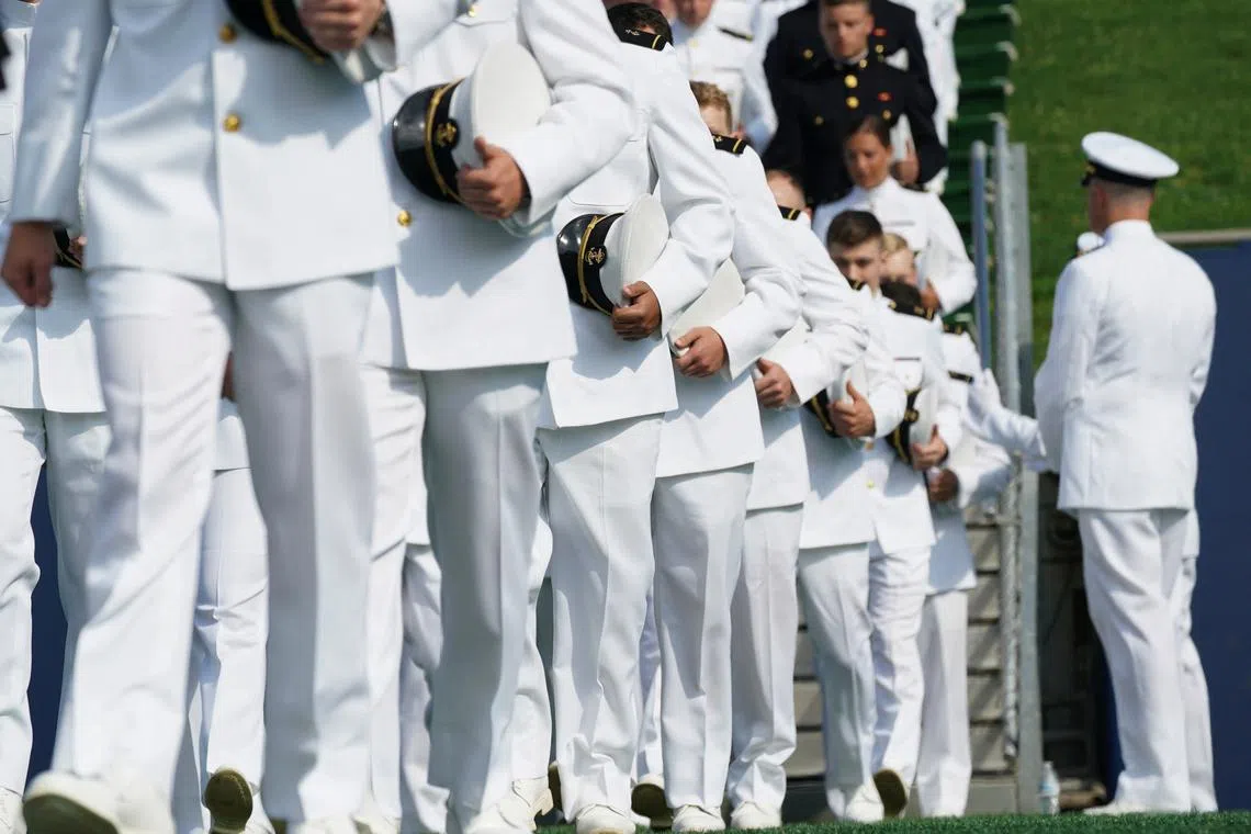 Midshipmen march onto the field during the commissioning and graduation ceremony at the U.S. Naval Academy in Annapolis, Maryland, U.S., May 24, 2024. REUTERS/Kevin Lamarque/File Photo
