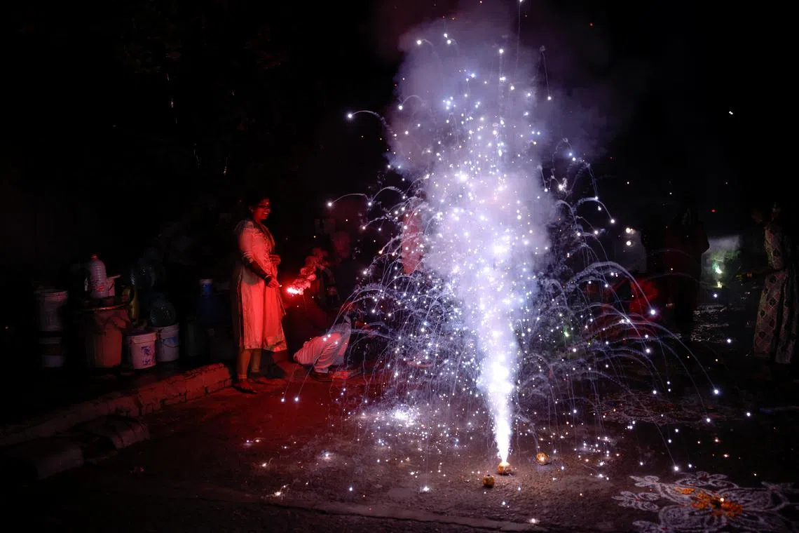 People light fireworks to celebrate Diwali, the Hindu festival of lights, in New Delhi, India, October 31, 2024. REUTERS/Anushree Fadnavis