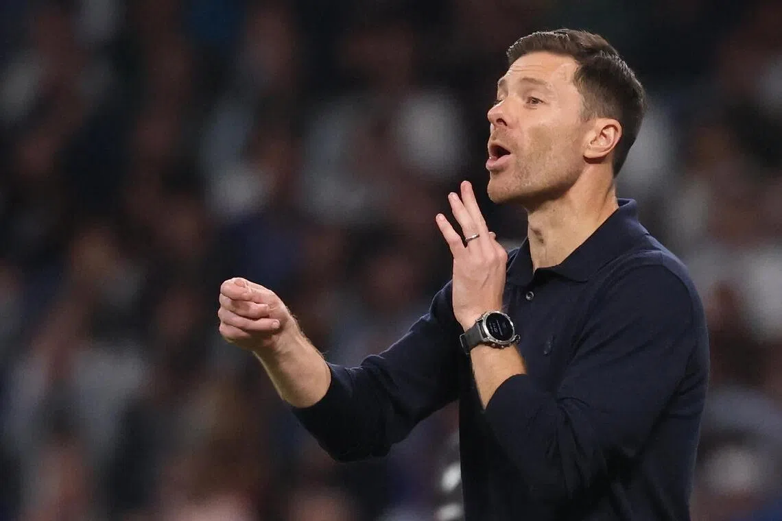 Real Madrid coach Xabi Alonso passing instructions during their 4-0 La Liga win over Valencia on Nov 1.