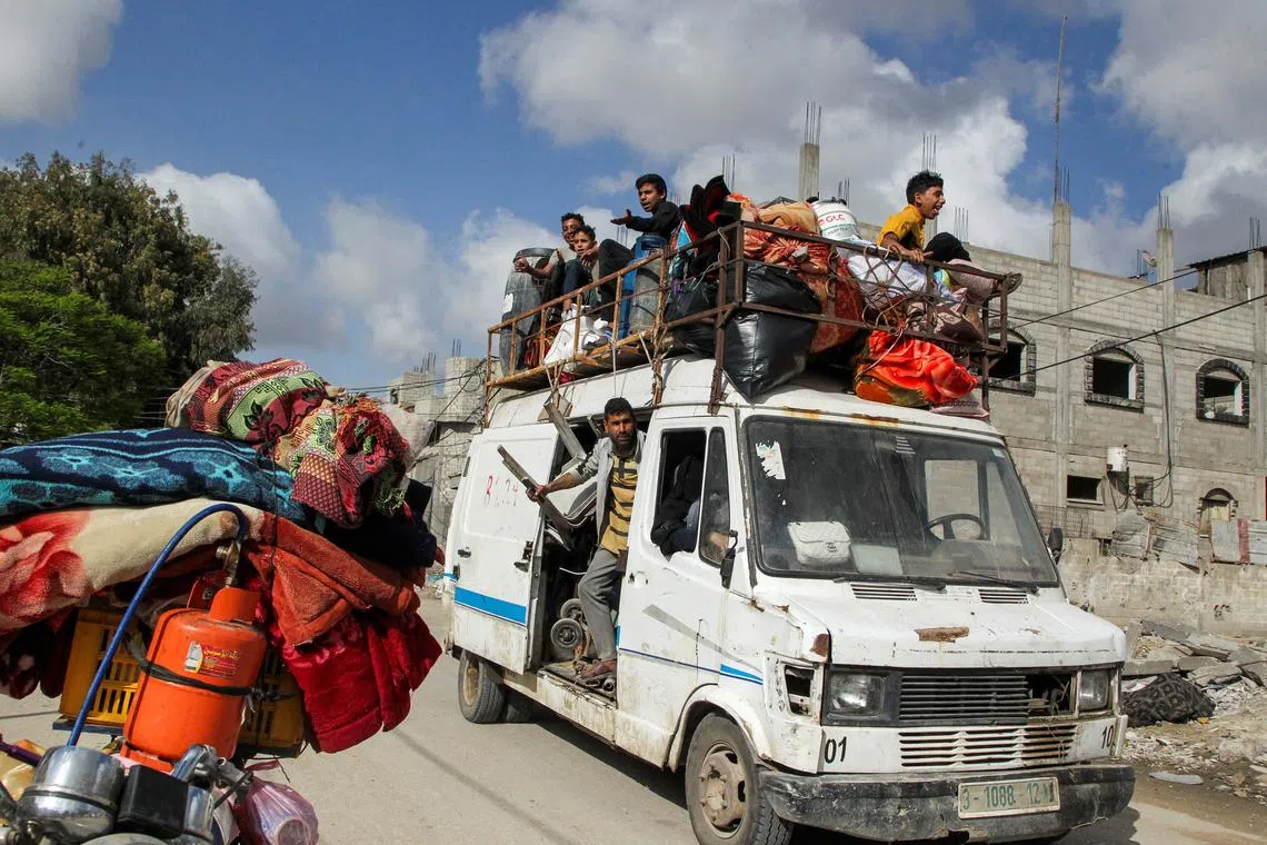 Displaced Palestinians travel in a vehicle as they flee Rafah, after Israeli forces launched a ground and air operation in the eastern part of southern Gaza city, amid the ongoing conflict between Israel and Hamas, in Rafah, in the southern Gaza Strip May 12, 2024. REUTERS/Hatem Khaled/ File Photo