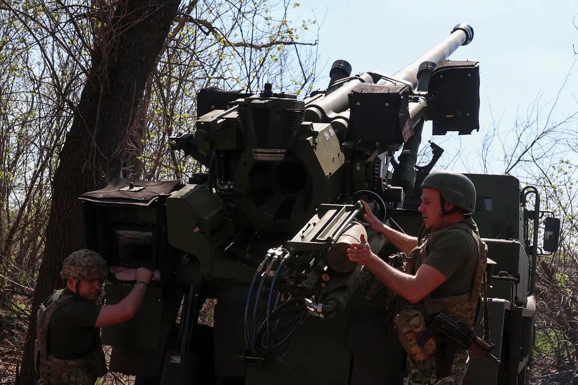 Ukrainian servicemen preparing a Caesar howitzer to fire towards Russian troops on April 18, on the front line in Ukraine's Donetsk region.