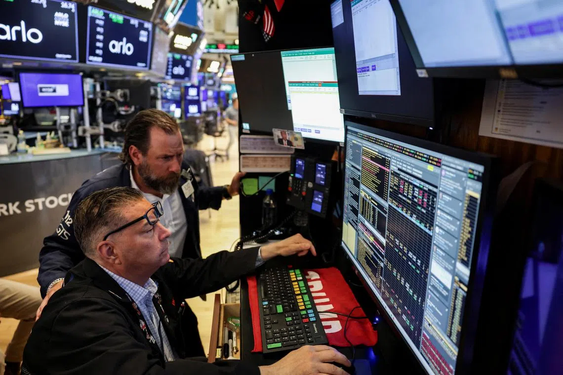 Traders working on the floor of the New York Stock Exchange, in New York City, on July 9.