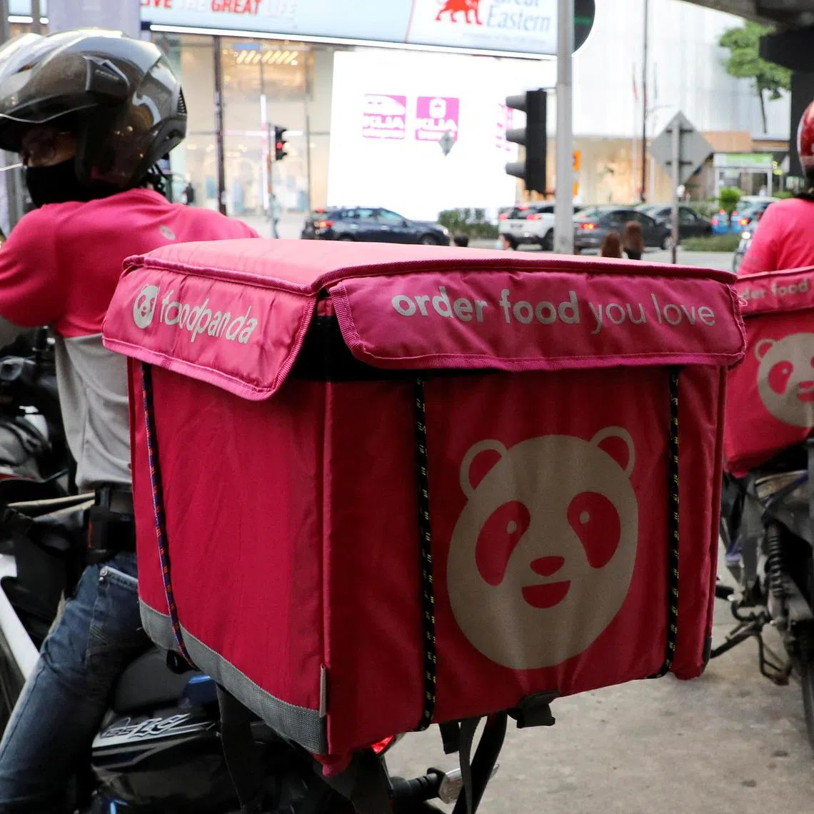 A 2020 photo showing Foodpanda riders getting ready to make deliveries outside a restaurant in Kuala Lumpur, Malaysia.