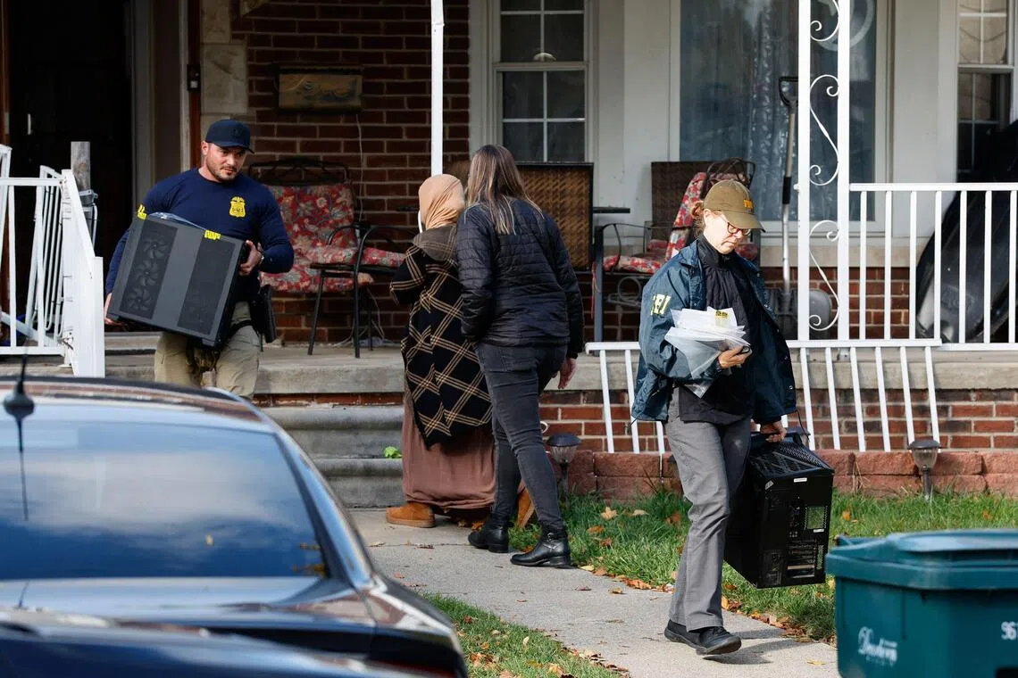 Members of the FBI removing items from a home in Dearborn, Michigan, on Oct 31.
