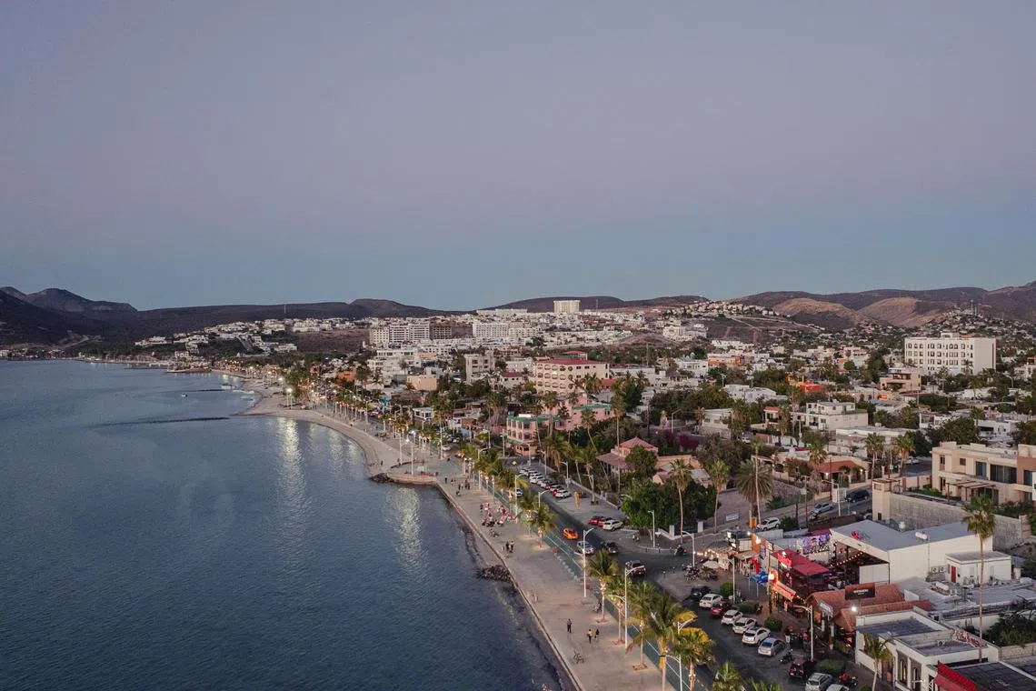 An aerial view of the coastline, dominated by a wide public walkway called the malec—n instead of private or commercial properties, in La Paz, Mexico, March 24, 2024. New hotels and destination-worthy restaurants now complement the ever-appealing outdoors surrounding La Paz, the capital of Baja California Sur. (Tanveer Badal/The New York Times)