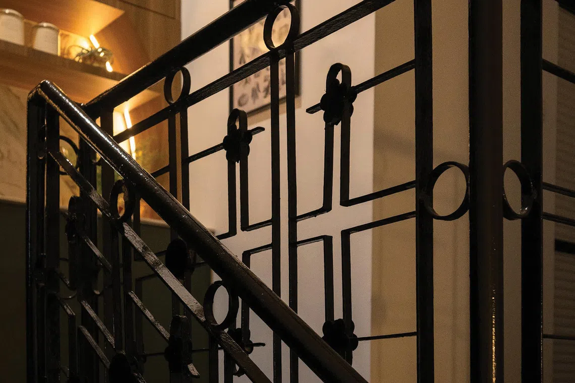 The intricately patterned stair railings are original to the house.