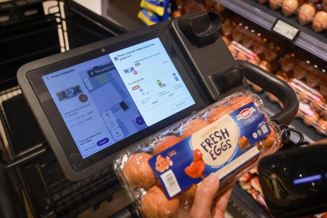 A customer scanning an item using a smart cart at Fairprice Finest at Punggol Coast on April 20.