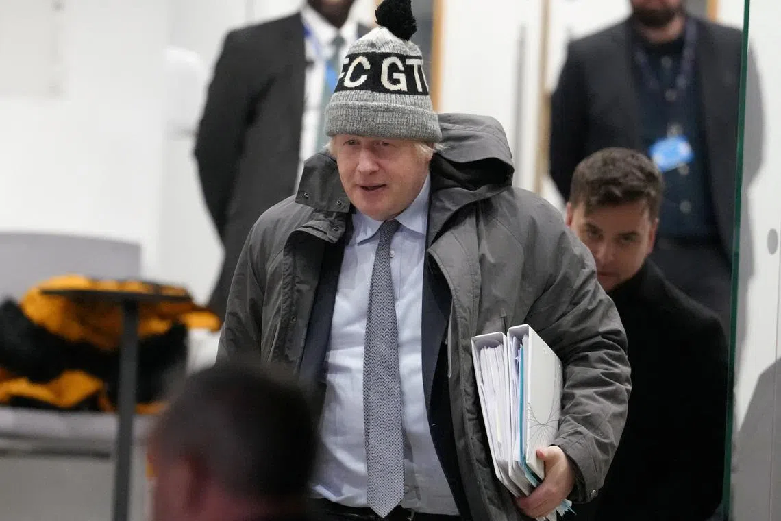 FILE PHOTO: Former British Prime Minister Boris Johnson walks outside the Dorland House on the day he gives evidence at the UK COVID-19 Inquiry, in London, Britain, December 6, 2023. REUTERS/Maja Smiejkowska/File Photo