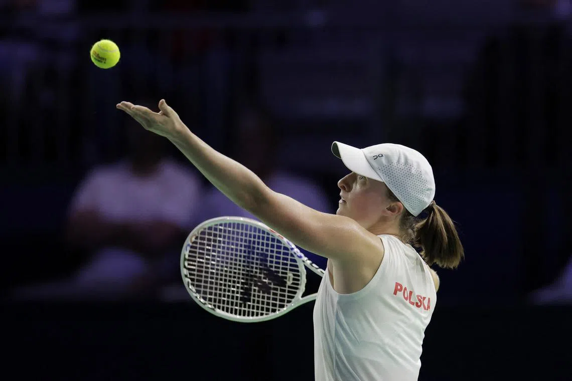 Tennis - Billie Jean King Cup Finals - Spain v Poland - Palacio de Deportes Jose Maria Martin Carpena, Malaga, Spain - November 15, 2024  Poland's Iga Swiatek in action during her match against Spain's Paula Badosa REUTERS/Jon Nazca