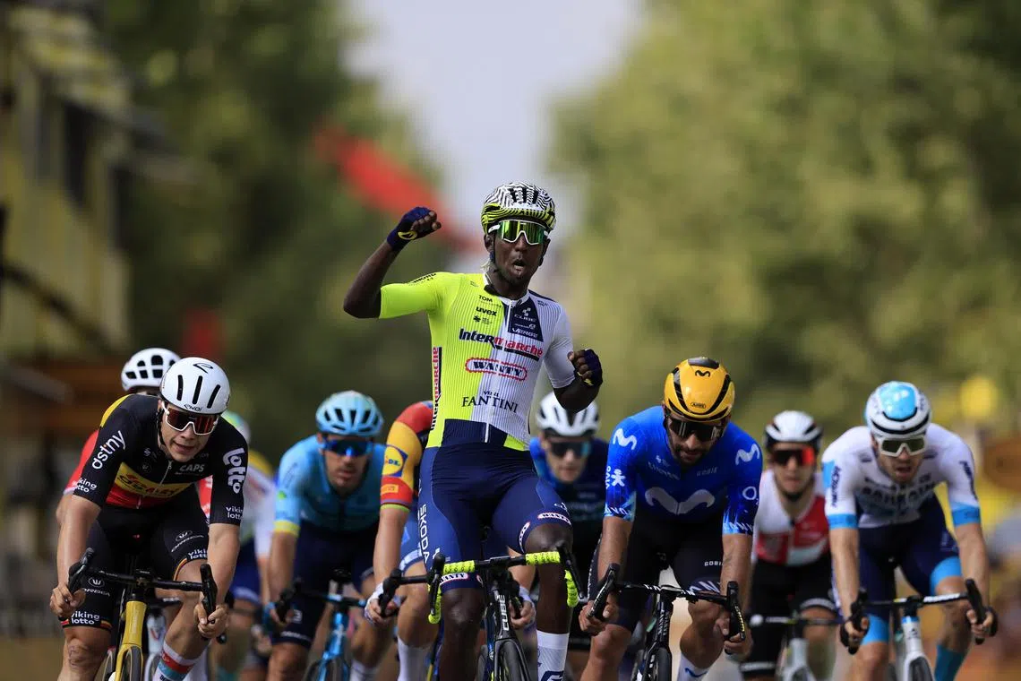 Eritrean rider Biniam Girmay of Intermarche-Wanty crossing the finish line to win the third stage of the 2024 Tour de France.