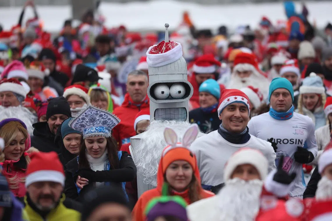 People participating in the Christmas race of Father Frosts (Santa Claus) at Luzhniki in Moscow, Russia, Jan 7, 2025. Russians celebrate Christmas on Jan 7 according to the Russian Orthodox Julian calendar. 