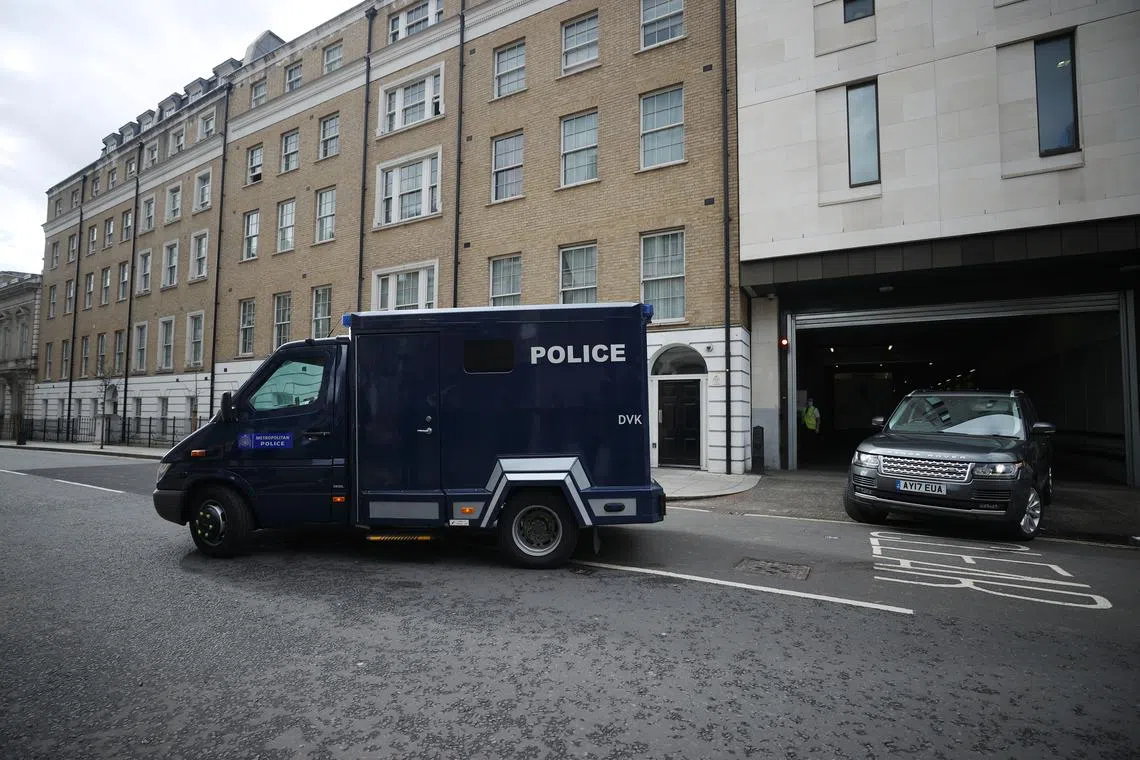 FILE PHOTO: A police van believed to be carrying British Police Officer Wayne Couzens who is charged with the murder and kidnap of 33-year-old Sarah Everard leaves the Westminster Magistrates Court in London, Britain, March 13, 2021. REUTERS/Hannah McKay/File Photo