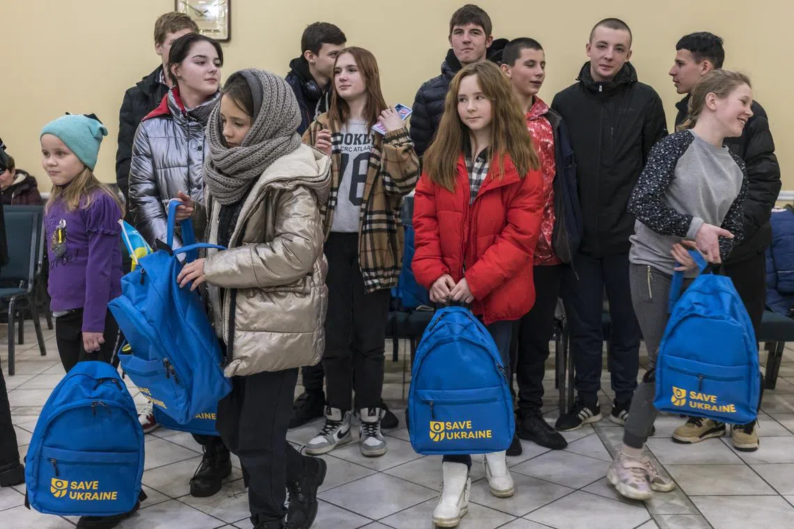 A group of 16 children who were taken from Ukraine to Russian territory are brought back to Kyiv by the group Save Ukraine, in February 2023.