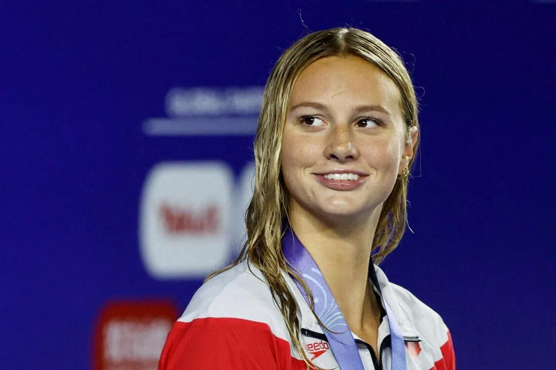 FILE PHOTO: Canada's Summer McIntosh celebrates after winning the Women's 400m Medley Final in the  World Aquatics Championships in Singapore in August 2025. REUTERS/Tingshu Wang/File Photo/File Photo