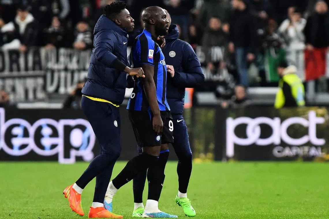 Romelu Lukaku's Inter teammates guiding him from the field after he was sent off in the first leg of the Coppa Italia semi-finals against Juventus.