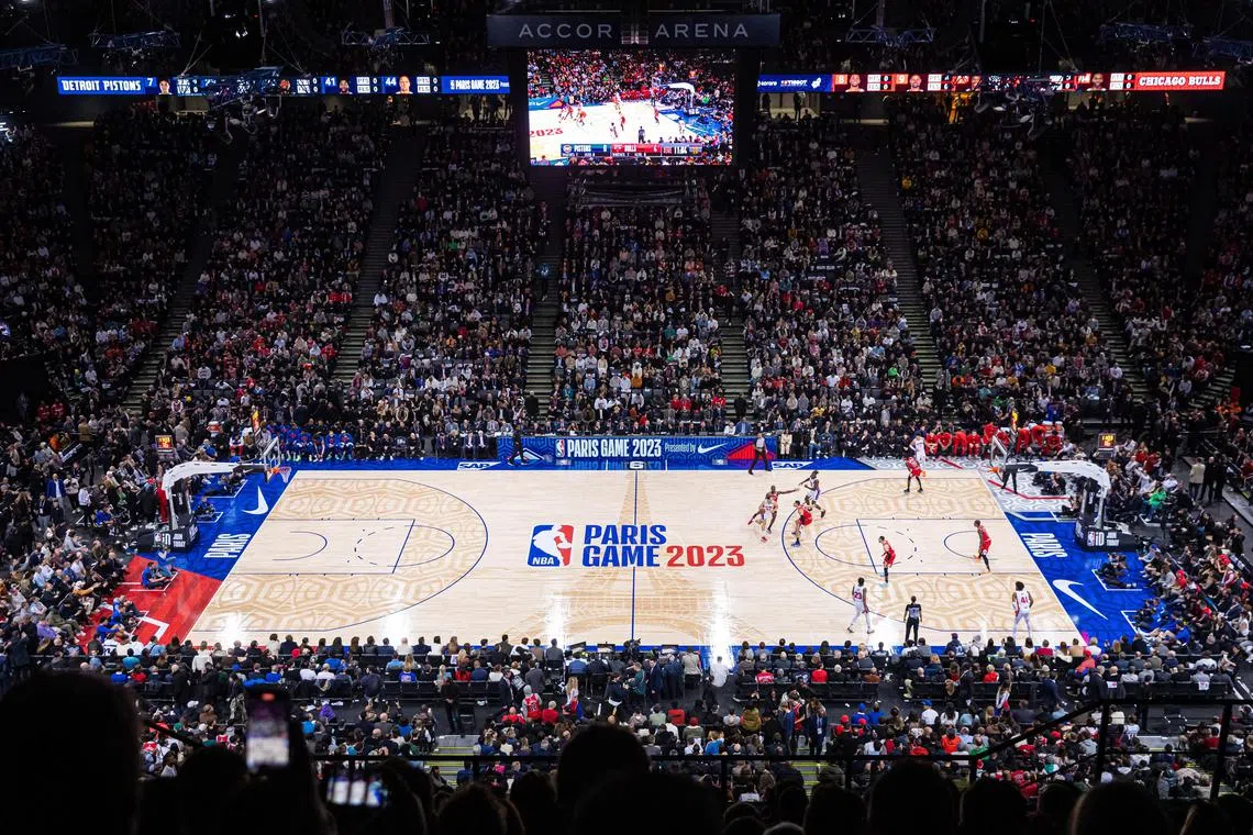 An aerial view of Chicago Bulls and Detroit Pistons players in action during the NBA game in Paris.