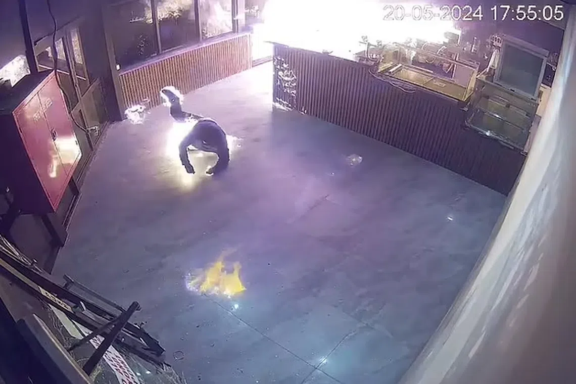 A video released by the Victoria state police shows a man rolling on the floor inside a restaurant in Melbourne he tried to set on fire.