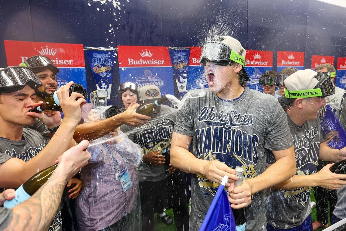 Shohei Ohtani of the Los Angeles Dodgers (centre) celebrating with teammates in the locker room after defeating the Toronto Blue Jays 5-4 in Game 7 to win the 2025 World Series at Rogers Centre on Nov 2, 2025 in Toronto.