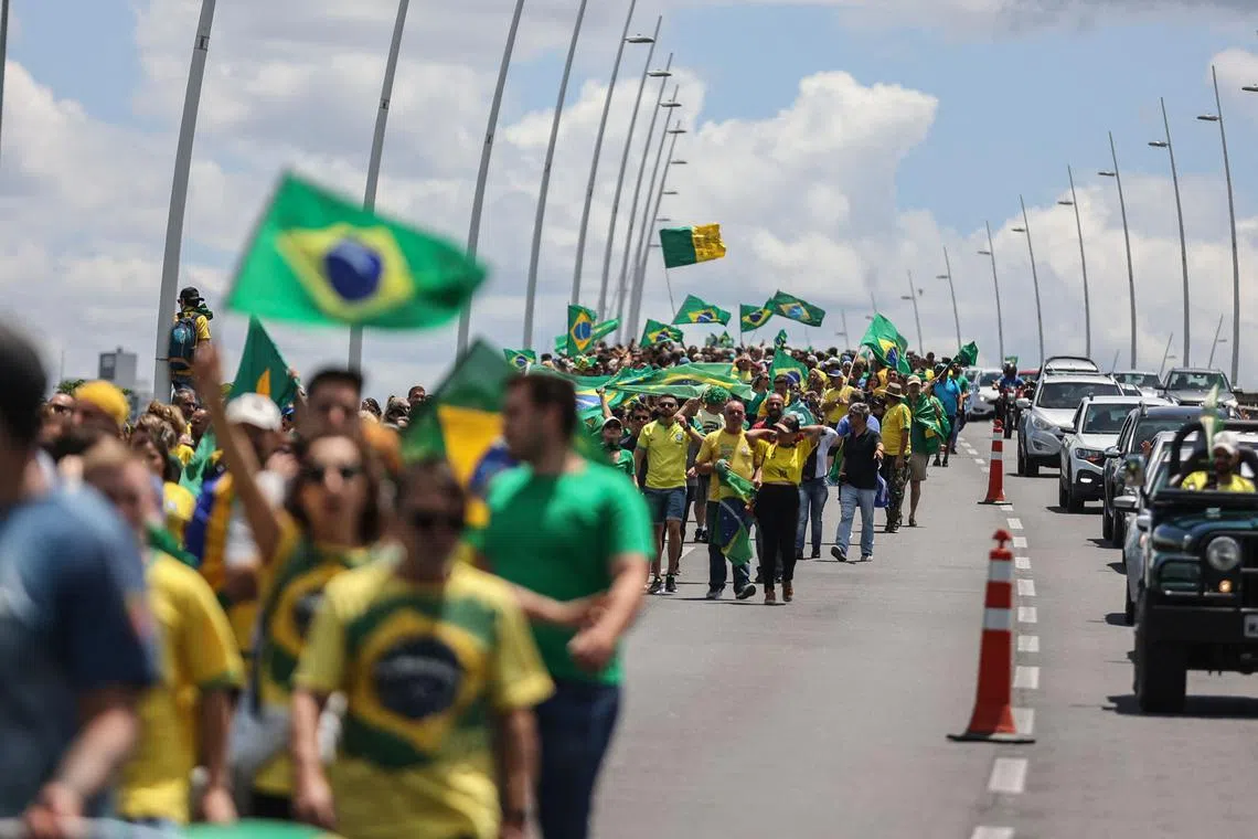 Supporters of Brazilian President Jair Bolsonaro marching to ask for federal intervention in Estreito, in Brazil's Santa Catarina state, on Nov 2, 2022.