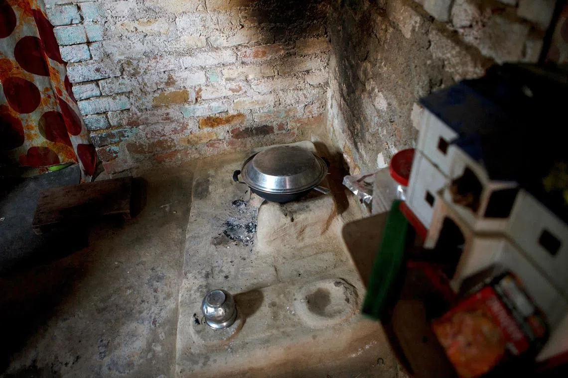 The wooden stove use by the poor scheduled caste Indian labours in Jajmau area to coock their daily life food, the sign of smoke in the wall can seen clearly.