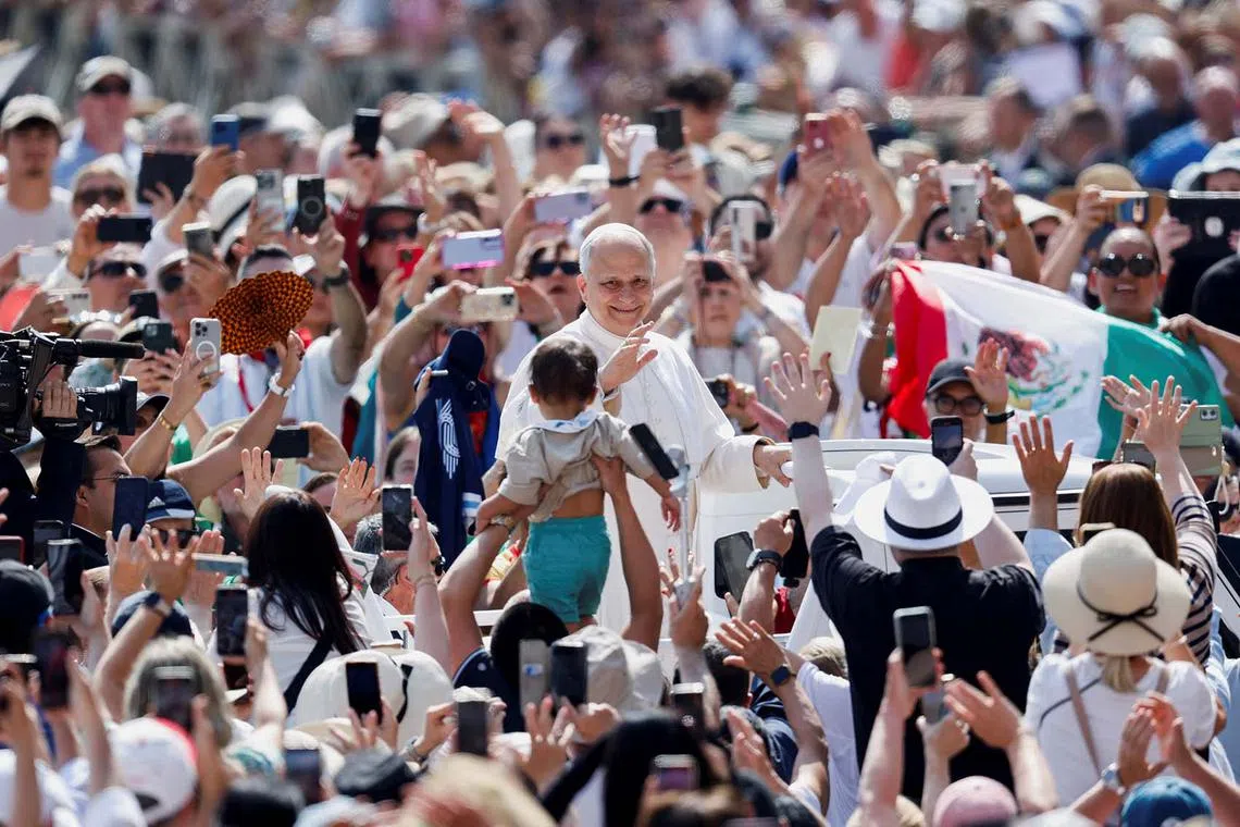 Pope Leo XIV gesturing as he holds a general audience in St. Peter's Square, at the Vatican, June 11, 2025. 