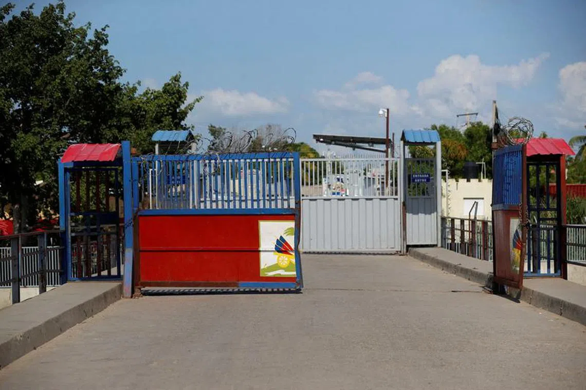 FILE PHOTO: The border gates of Haiti stay open for Haitians to return from the Dominican Republic after Dominican President Luis Abinader announced an imminent total border shutdown amid a conflict over the construction of a water channel from a shared river, in Ouanaminthe, Haiti September 14, 2023. REUTERS/Octavio Jones/File Photo