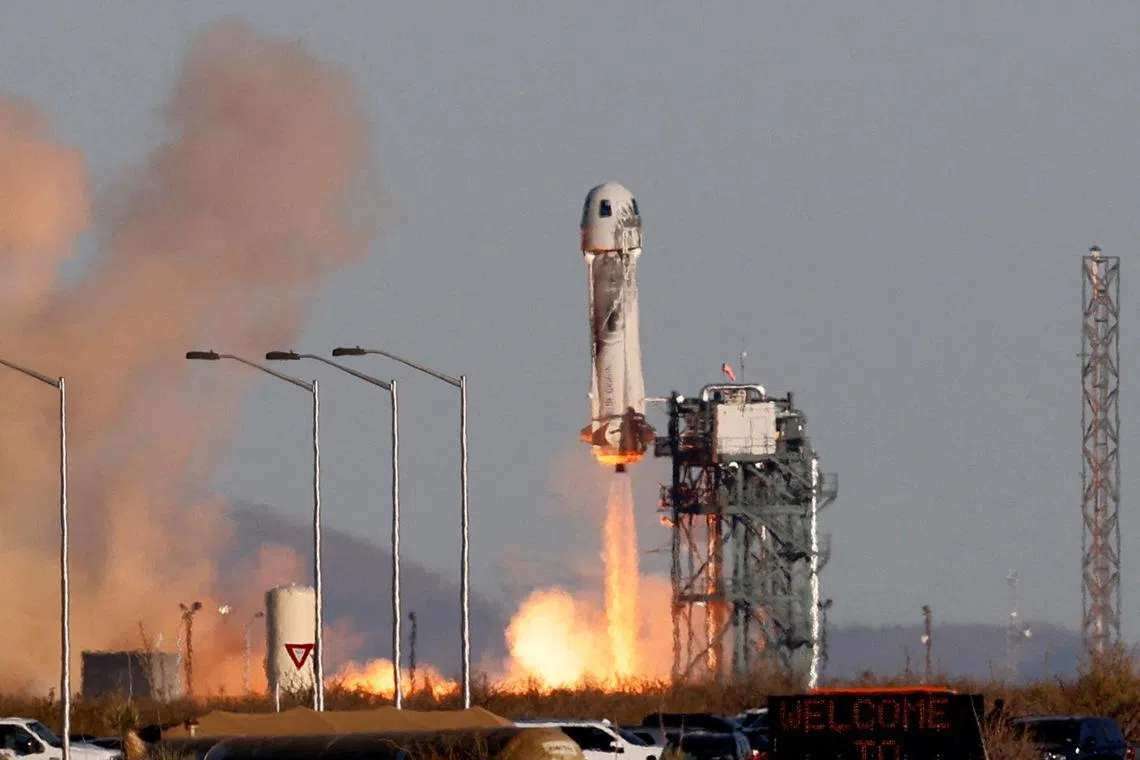 A Blue Origin New Shepard rocket lifts off with a crew of six, from Launch Site One in west Texas, on Dec 11.
