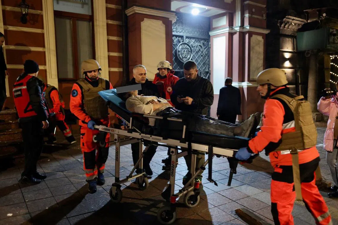 A woman injured in the Russian attack on the Ukrainian city of Odesa is taken for treatment, in a photo uploaded to social media.